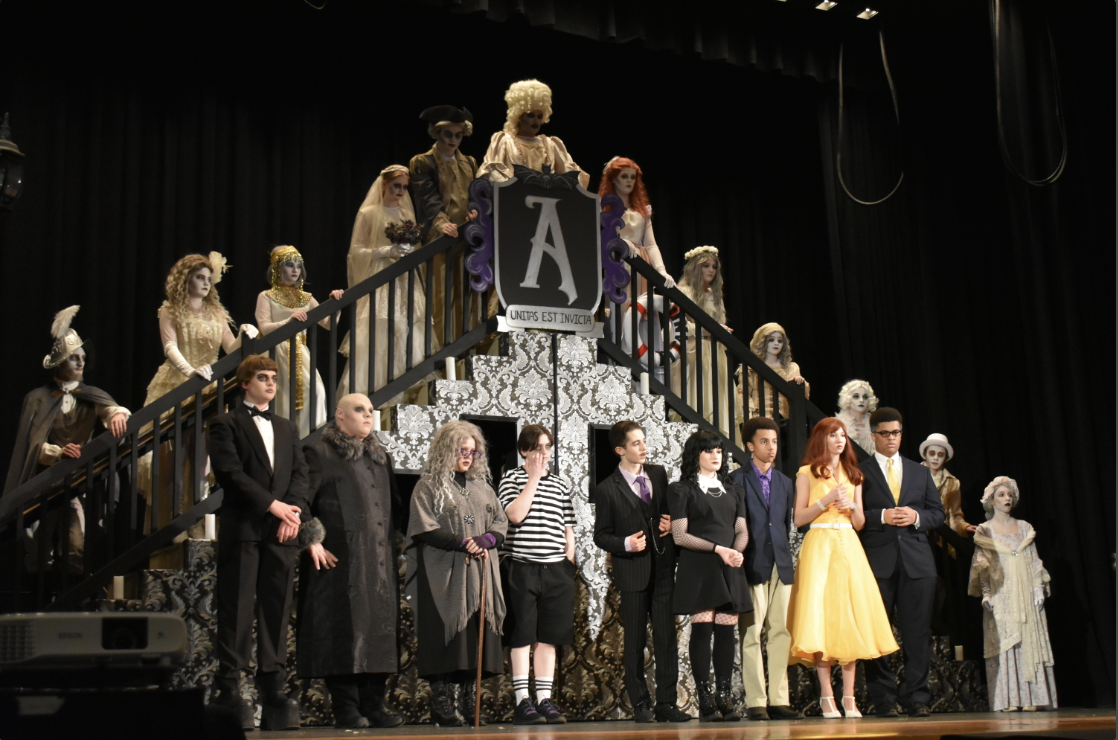 The+cast+of+The+Addams+Family+performs+one+of+their+numbers+on+stage.+